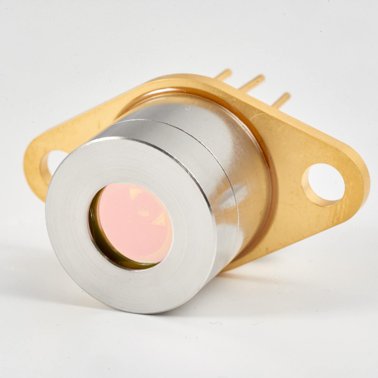 A close-up image of a cylindrical electronic sensor with a metallic body and a gold-colored base featuring two mounting holes and four connector pins. The lens is visible at the front.