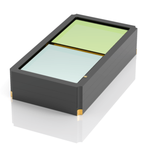 A rectangular black box with gold corners, featuring two glass-like panels on top—one green and one light blue—separated by a thin divider. The box is shown on a reflective white surface.