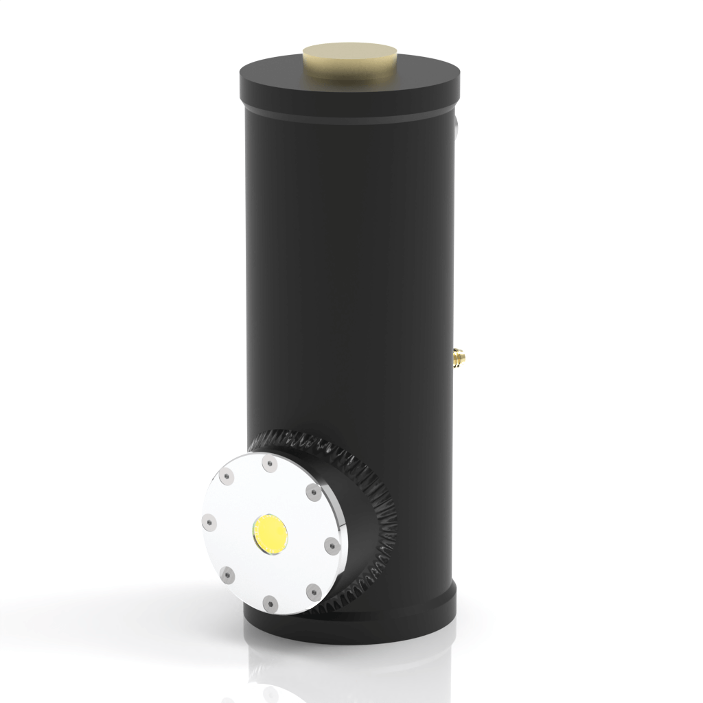 A black cylindrical device with a metallic circular panel featuring a yellow center on the side, and a beige cap on the top, standing upright against a white background.