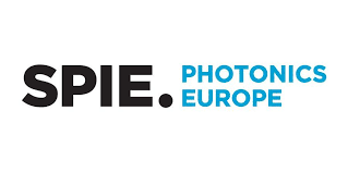 Logo for SPIE Photonics Europe. The word SPIE. is in bold black text, while PHOTONICS EUROPE appears in uppercase blue text to the right on a white background.