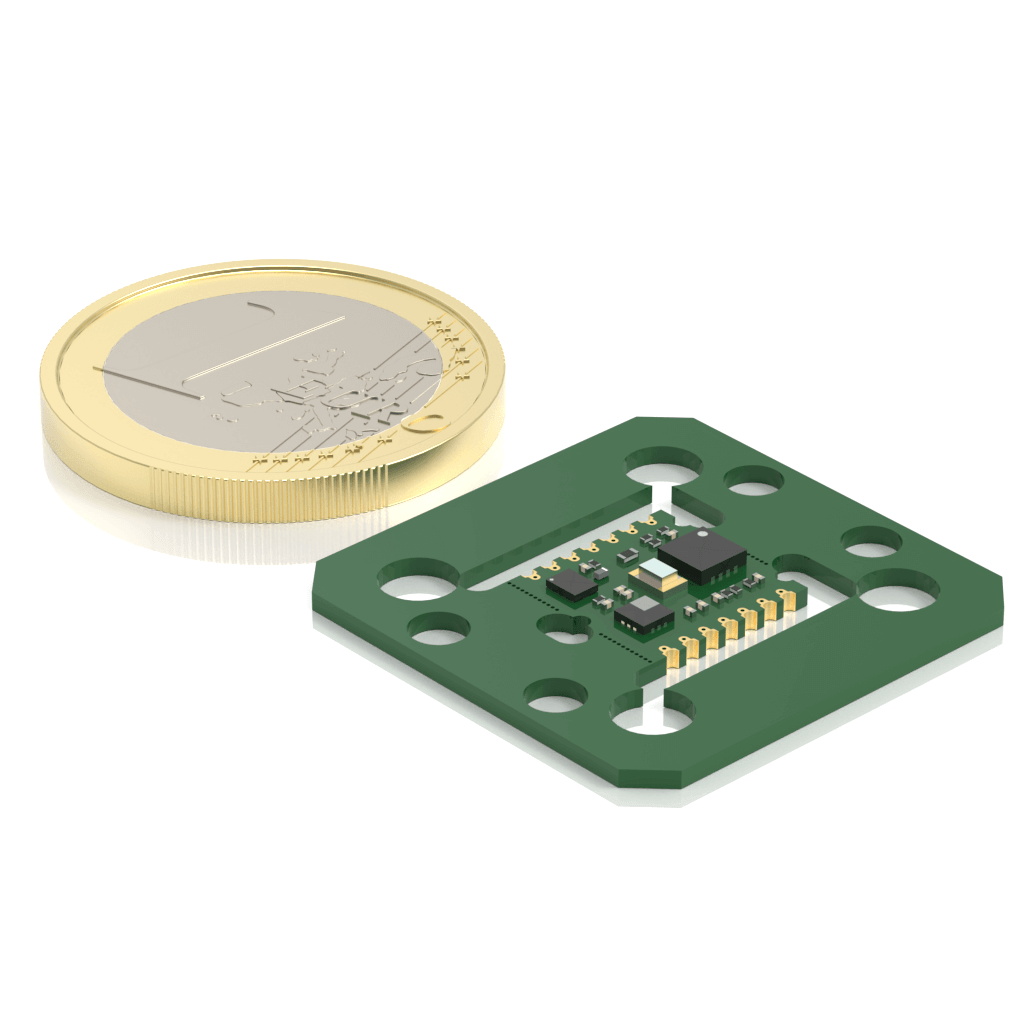 A small green electronic sensor board sits next to a one-euro coin, highlighting the compact size of the sensor compared to the coin.