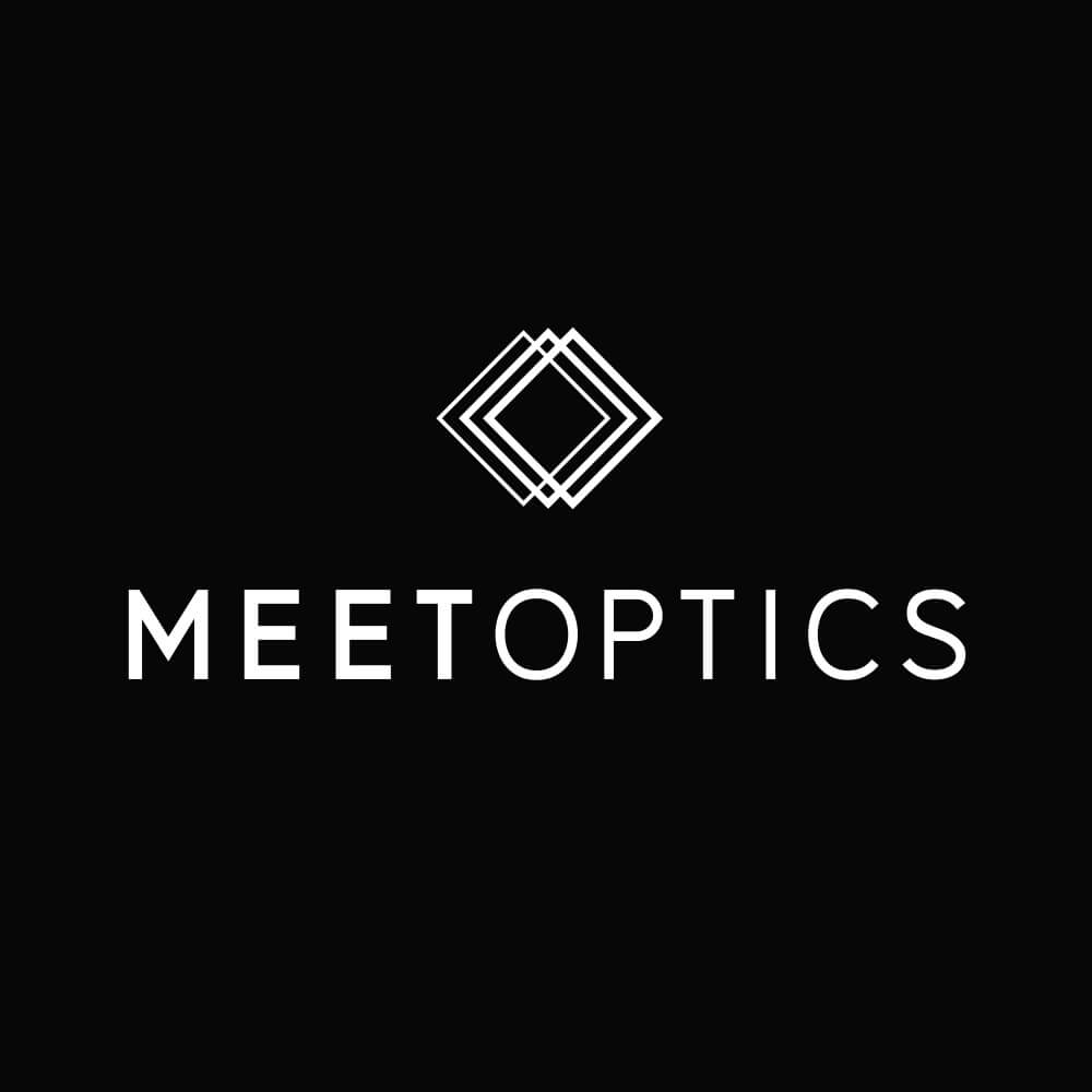 White geometric diamond shapes above the text MEETOPTICS in all caps, on a black background. The word MEET is bold, while OPTICS is in a lighter font.