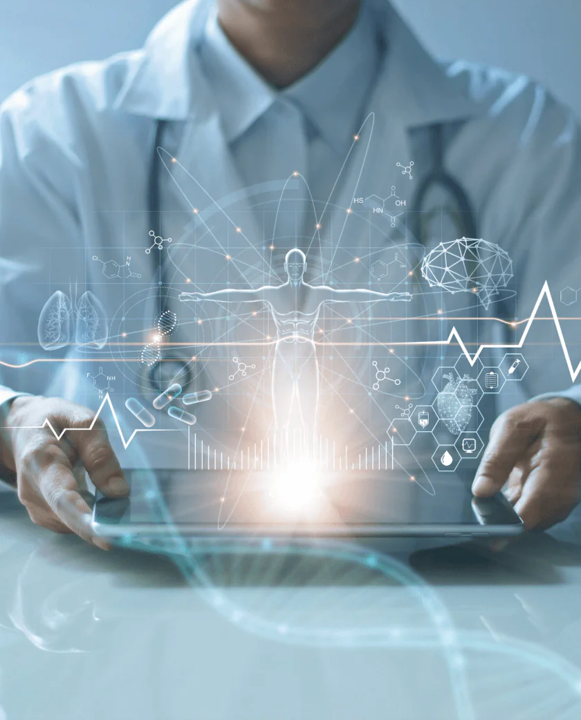 A medical professional holds a tablet projecting holographic images, including a human figure, lungs, brain, and DNA strands. Various medical symbols and graphs surround the display, suggesting a blend of healthcare and technology.