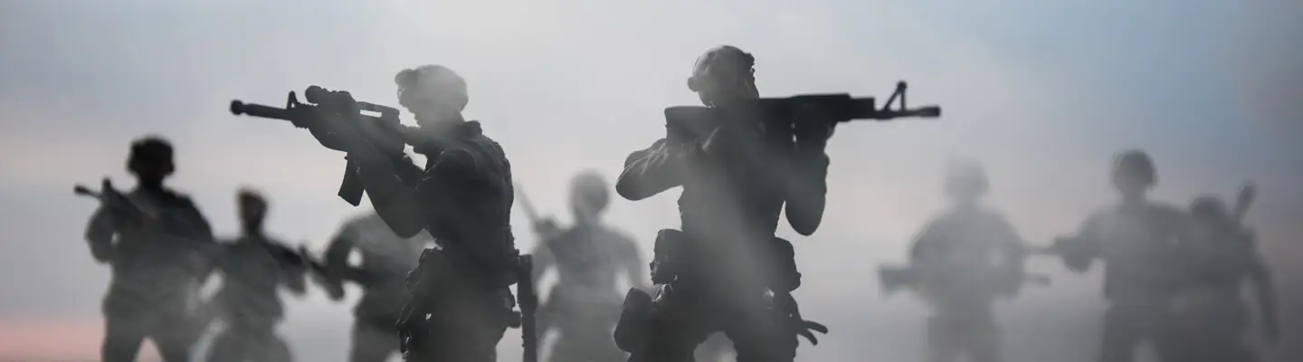 Silhouetted miniature army figures in a dramatic scene, holding weapons and set against a misty backdrop, conveying a sense of tension and urgency.