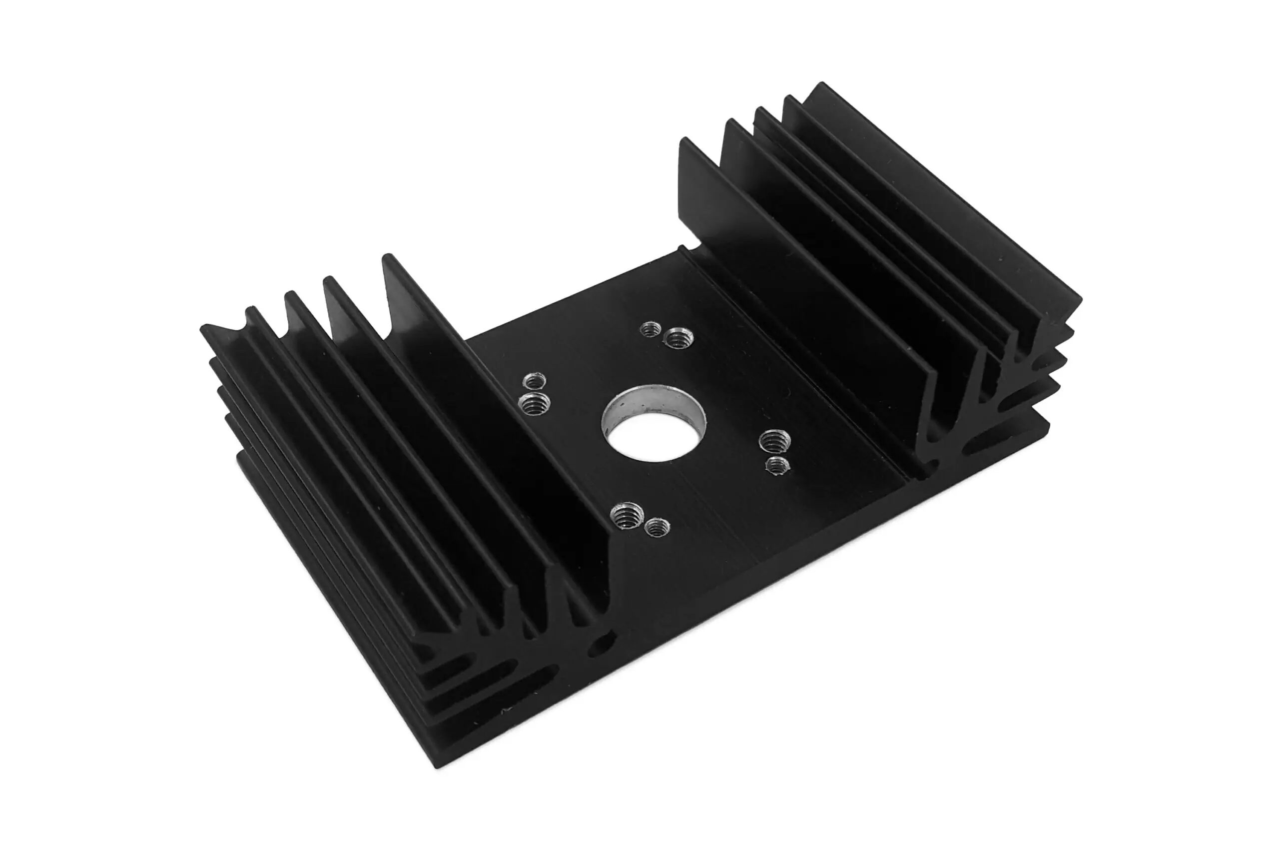 Black aluminum heatsink with a central circular hole, multiple surrounding screw holes, and finned sides for enhanced heat dissipation. The device is shown against a plain white background.