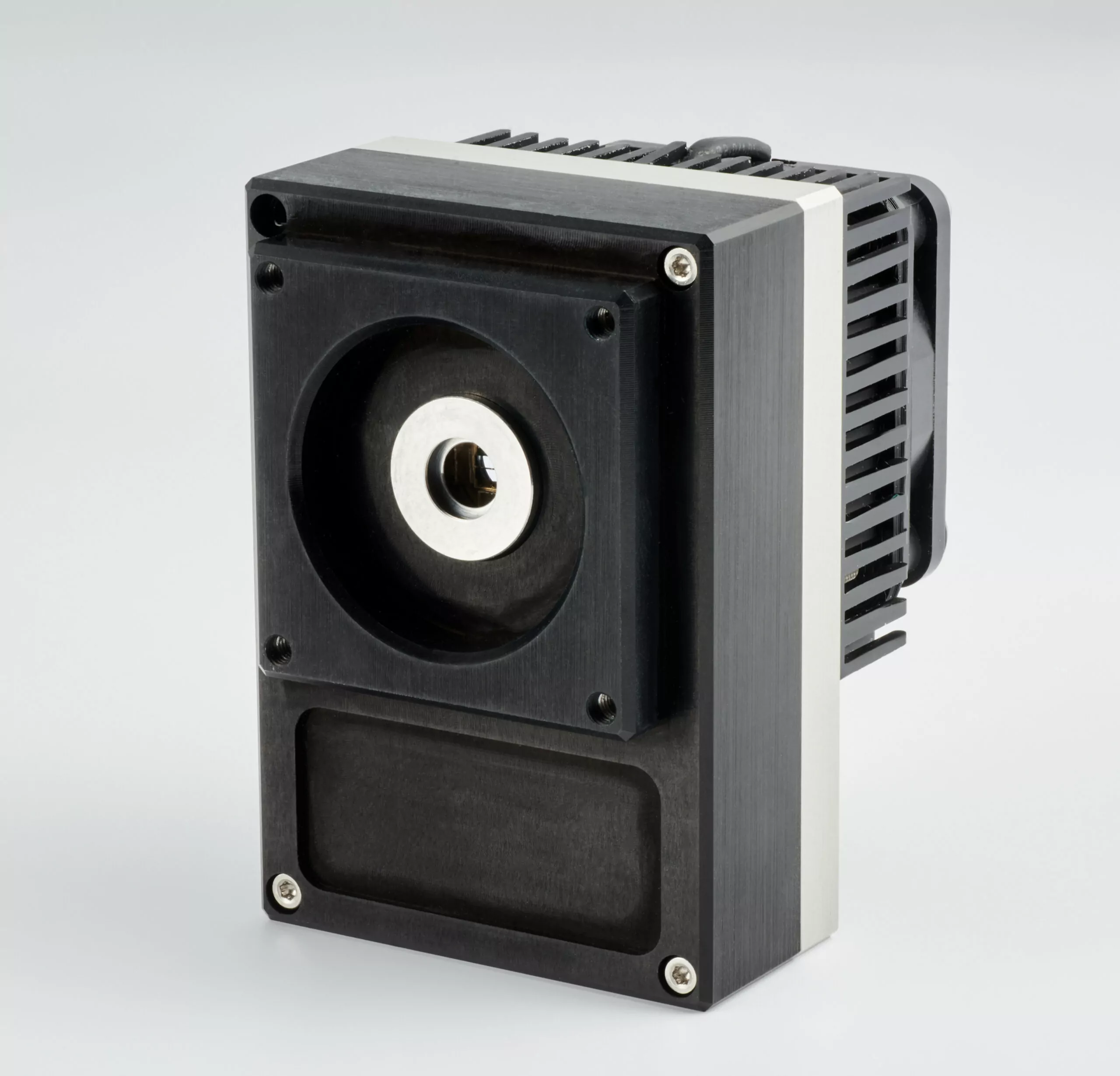 A black and silver stepper motor with a square metal frame and cooling fins, featuring a circular central component and multiple screw attachments against a plain light gray background.
