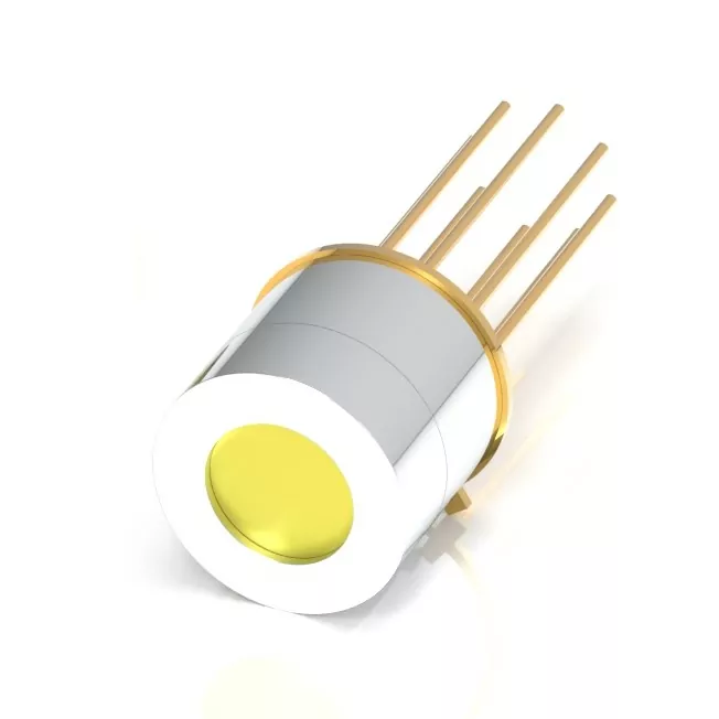 A cylindrical electronic component with a metallic finish and a yellow circle on one end. It has multiple metal pins extending from the opposite side, arranged in a circular pattern. The background is plain white.