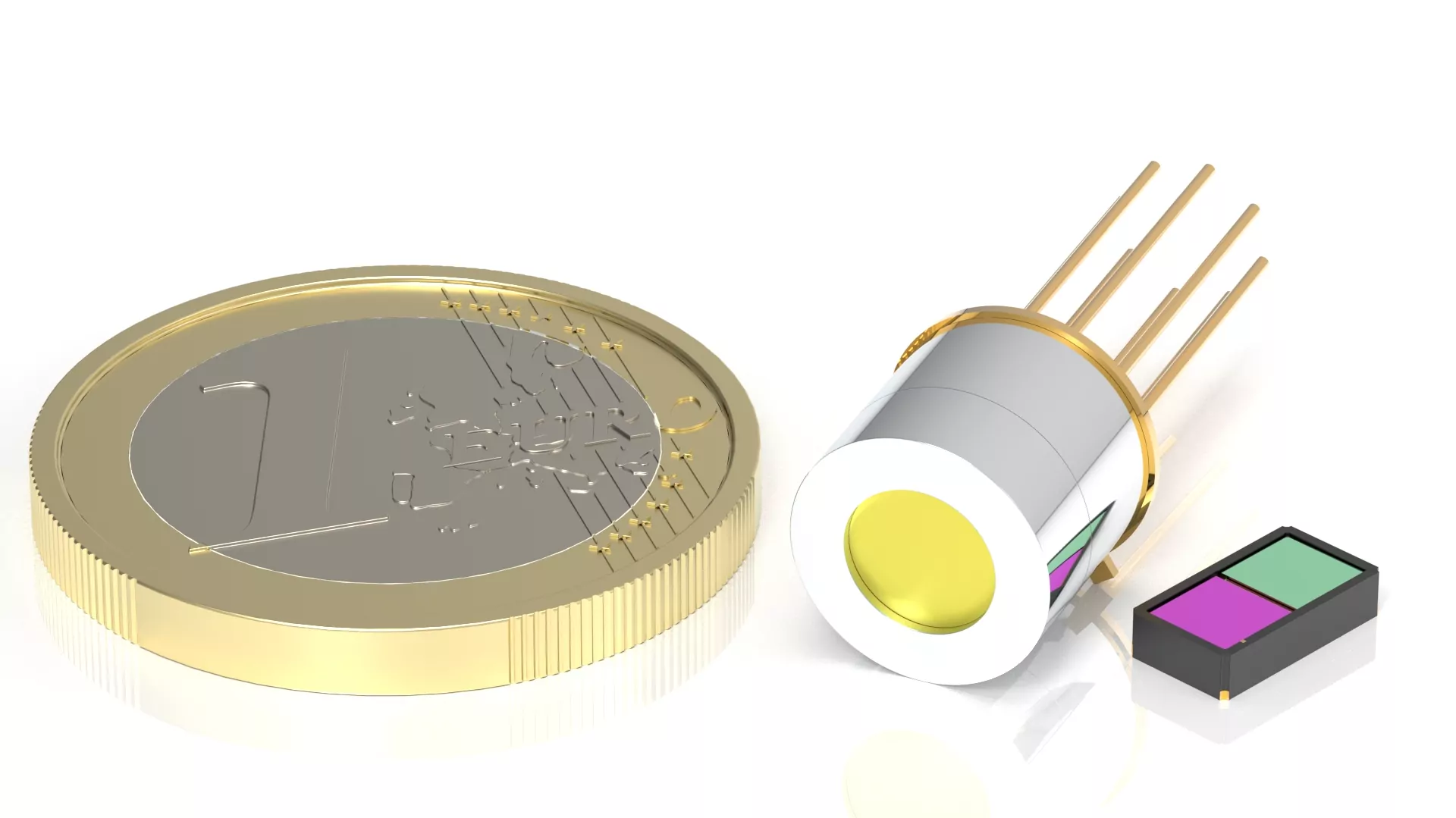 A close-up image showing a one-euro coin next to a cylindrical infrared detector with several pins and a small rectangular device with two colorful panels, highlighting size comparison.