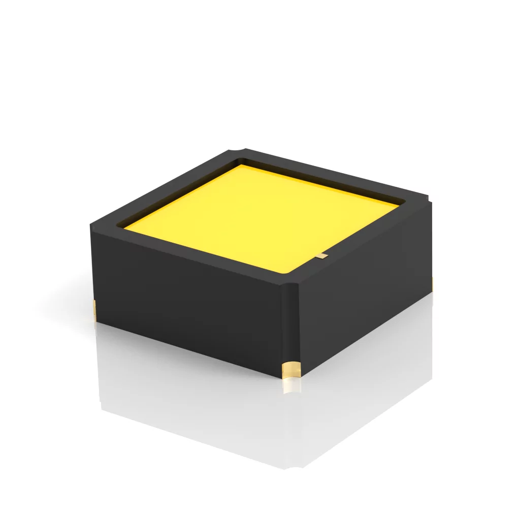 A small, square, black electronic component with a yellow top surface is shown on a white background. The component has gold accents on its corners.