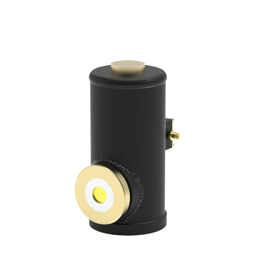A black cylindrical device with gold accents, featuring a large circular knob on the front and a small gold connector on the side.