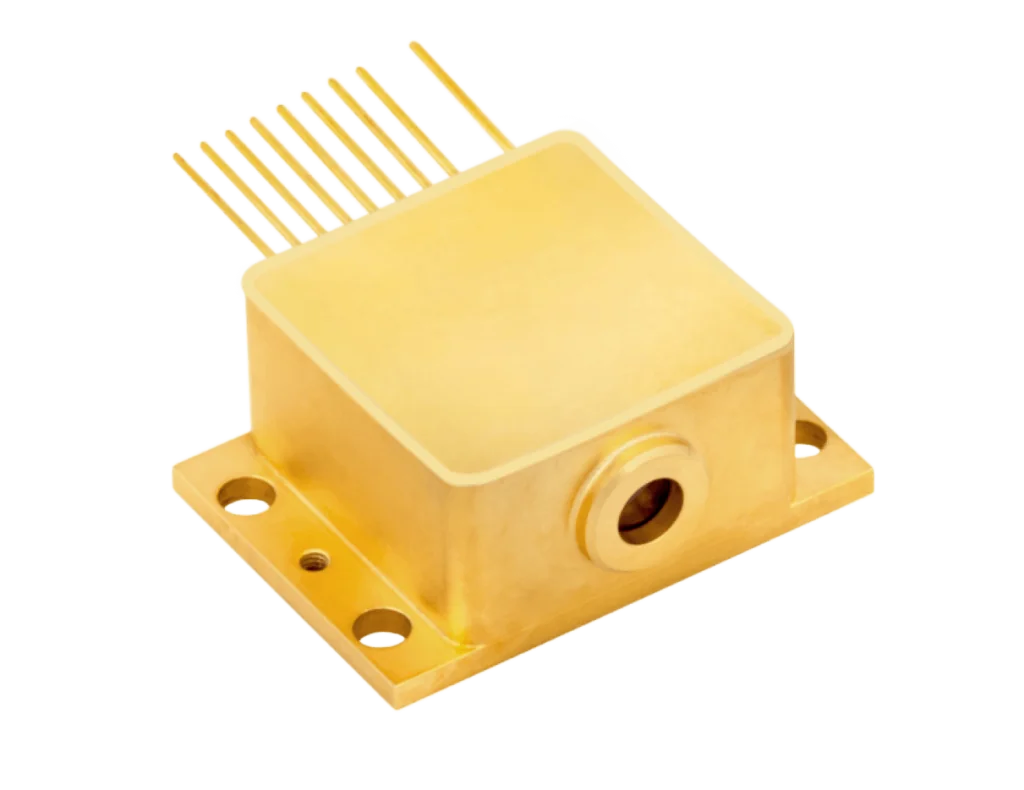 A gold-colored electronic component with a rectangular body, multiple metal pins extending from one side, and a circular opening on the front, mounted on a base with four screw holes.